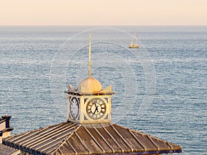 Old clock on a tower of Eastbourne's Pier