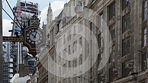 old clock on the wall and city buildings, London, England, UK, United Kingdom