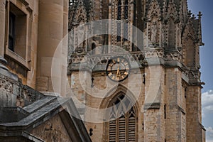 Old clock on wall of St. Mary's church in Oxford, England