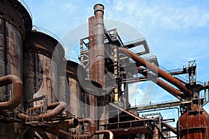 Old close blast furnace under sky