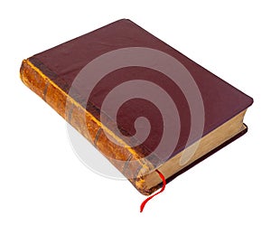 Old closed brown book with red bookmark