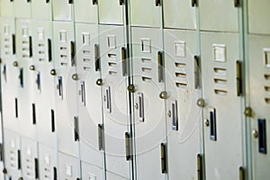 Old closed locker row in university school or gym vintage old