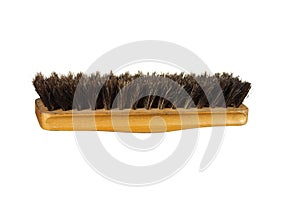Old clothes (or shoe) brush with wooden handle isolated on the w