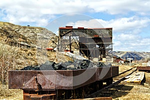 Old coal filled rusted wagons