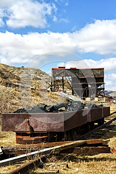 Old coal filled rusted wagons