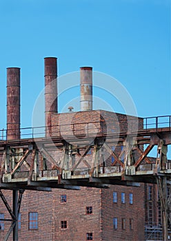 Old coal-fired power station with blue sky, portrait format