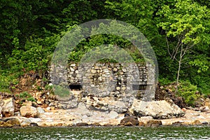 Old coastal fortification pillbox made of natural stones.