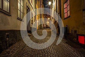 Old cobbled colorful  narrow street in Stockholm at night - 5