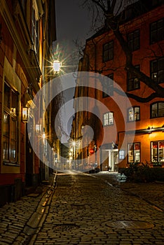 Old cobbled narrow street in Stockholm at night