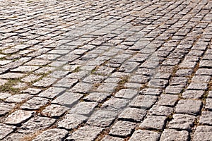 Old cobblestone pavement. Street with granite cobblestoned pavement photo