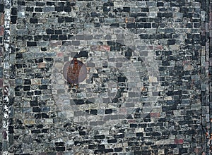 Old cobblestone road with hatch for background or texture