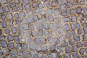 Old cobblestone road pavement texture