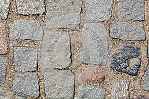 Old cobblestone road pavement texture