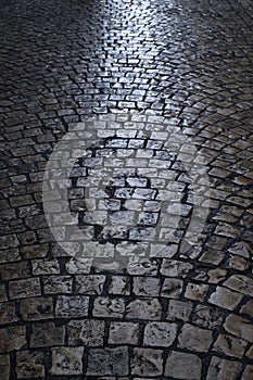 Old cobblestone street at night vertical