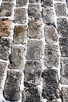 Old cobblestone street with snow