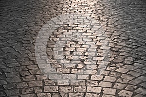 Old cobblestone street warm light background texture