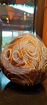 Old coconut in art brown collor with sculpture