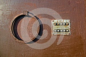 Old coded lock with round buttons on the iron door, close-up, old painted door, lock. Texture of paint on metal