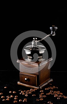 Old coffee grinder and coffee photo
