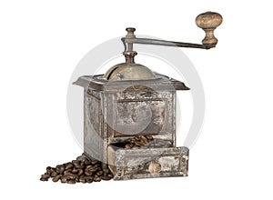 Old coffee grinder with coffee beans isolated
