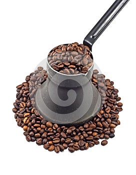 Old coffee pot with coffee beans