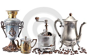 Old coffee pot, samovar, grinder coffee and beans isolated on white background