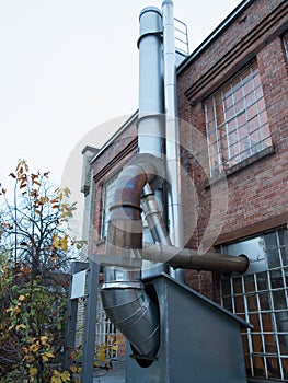 Old coffee-roasting establishment building with brick walls and chimney