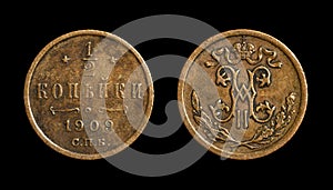 Old coin 1/2 kopek on black background, copper money of Russia 1909