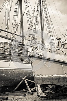 Old collapsing sailboats at the dock, close-up