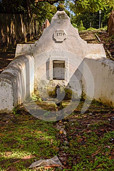 Old colonial fountain of Pedra at Alcantara in Brazil photo