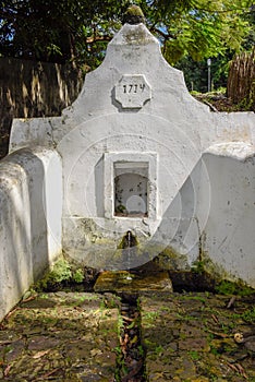 Old colonial fountain of Pedra at Alcantara in Brazil photo