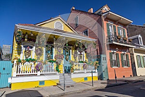 Old Colonial Houses on the Streets of French Quarter decorated for Mardi Gras in New Orleans, Louisiana