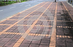 Old color Long paved brick footpath, Brick path or sidewalk with perspective going into the distance.