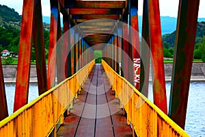 Old colored bridge over river