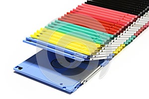 Old colored computer floppy disks isolated on white background.