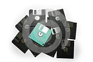 Old colored computer floppy disks isolated on white background.
