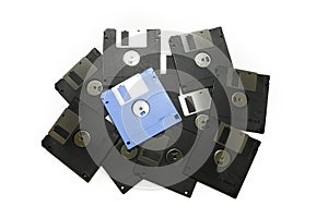 Old colored computer floppy disks isolated on white background.