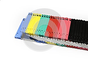 Old colored computer floppy disks isolated on white background.