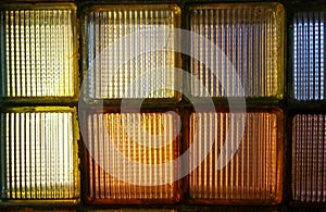 Old colored glass blocks with penetrating light, instead of a window