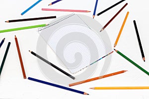 Old colored wooden pencils on the white board background