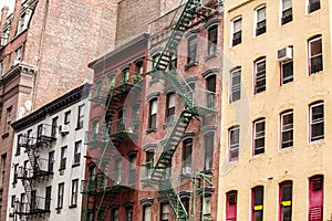 Old colorful buildings with fire escape,NYC, USA