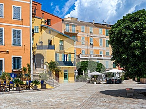 Old colorful buildings on the small town square in Menton, France