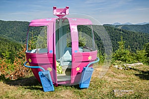 Old colorful cable car cabin on top of Velka Raca skiing resort near Oscadnica