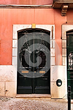 Old and colorful carved wood door with iron details