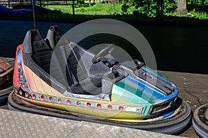 Old colorful electric bumper car in autodrom in the fairground attractions at amusement park