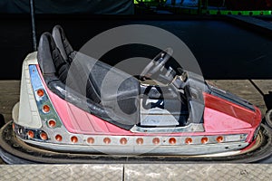 Old colorful electric bumper car in autodrom in the fairground attractions at amusement park