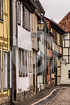 Old, colorful facades along a cobblestone street in Quedlinburg