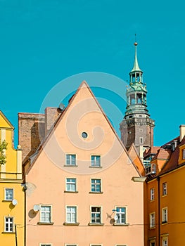Old colorful facades of houses in medieval european city. Cozy pastel color houses with tiled roofs in Wroclaw, Poland