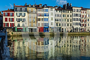 Old colorful houses of `Le Petit Bayonne` district along the river Nive, Bayonne, France
