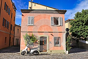 Old colorful houses and scooter in Rimini